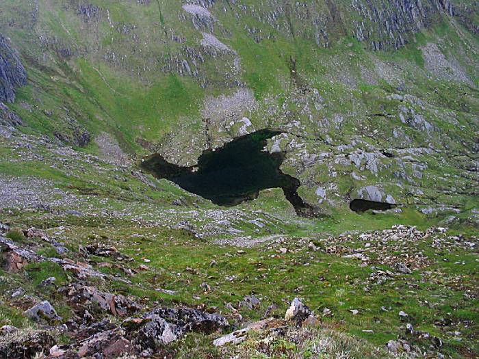 little Loch Uaine below the Munros and the headwall